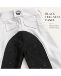 Close-up of the back waistband and seat area of riding breeches, showing a white outer panel and a black inner full-seat panel with an allover embossed crown pattern. Text on the right reads 'BLACK FULL-SEAT PANEL' and 'Enhanced crown grip.